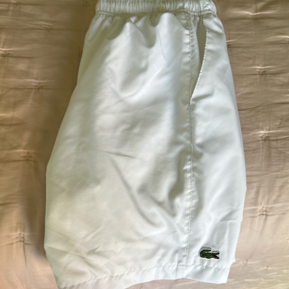 Boys white Lacoste tennis shorts